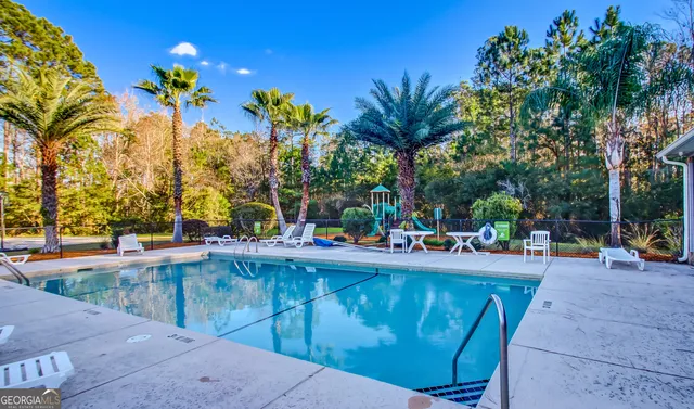 a view of a backyard with a sitting area