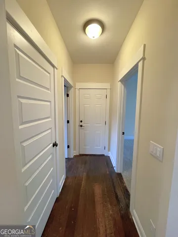 a view of a room with wooden floor and closet