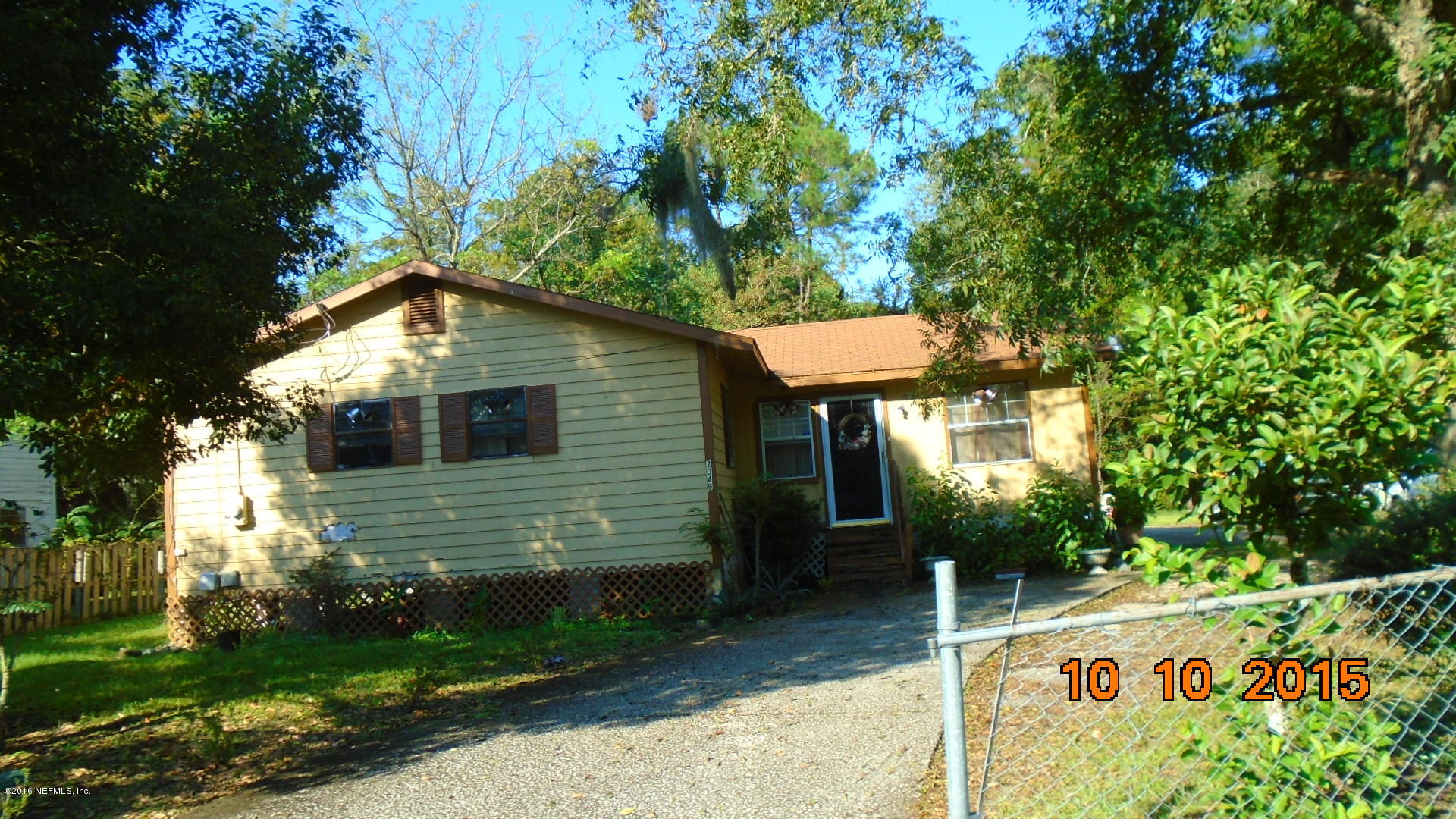 2049 Benedict Road Jacksonville, FL 32209 - Photo 1 of 6 a front view of a house with garden