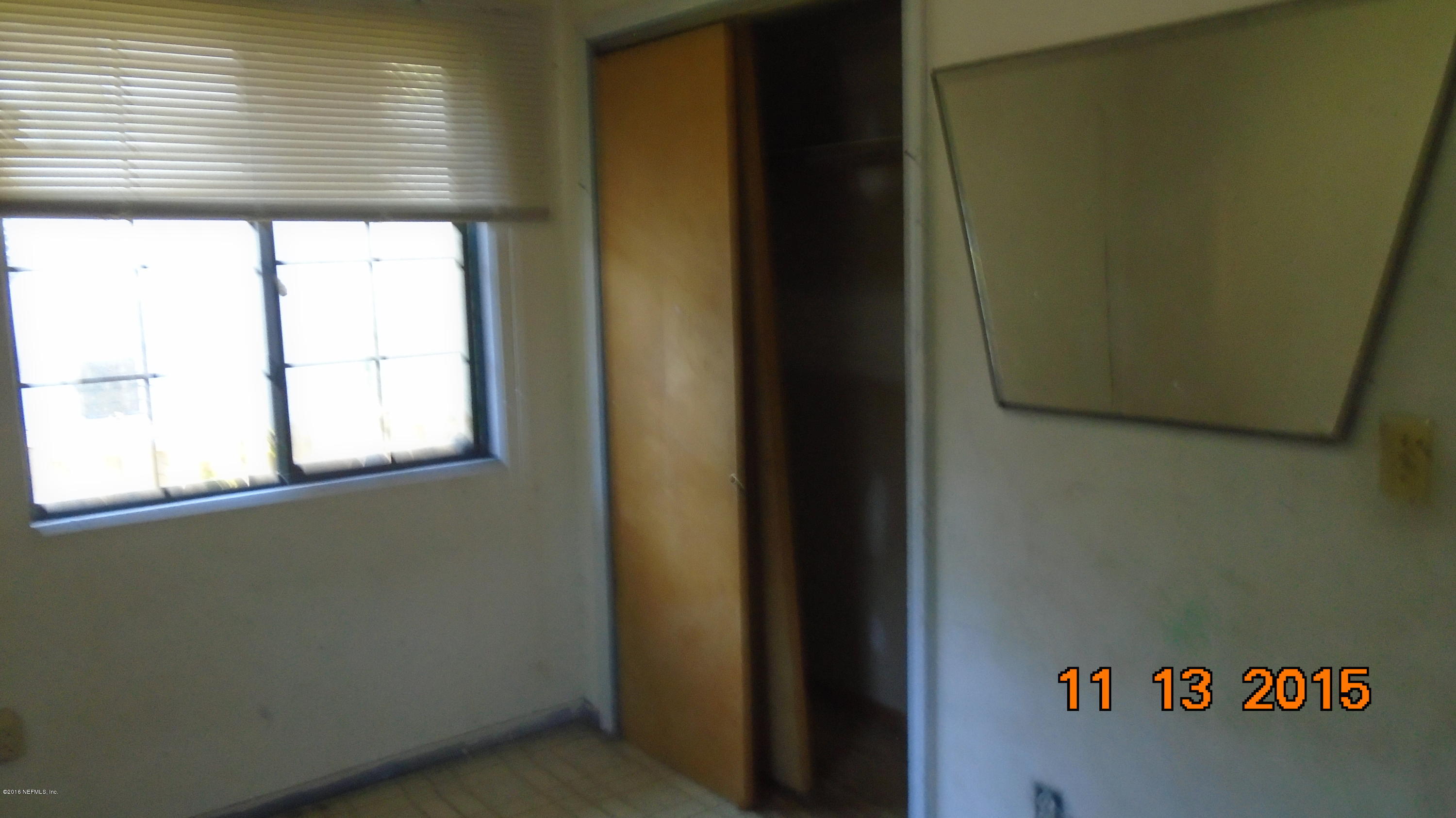 2049 Benedict Road Jacksonville, FL 32209 - Photo 4 of 6 a view of a door and an empty window