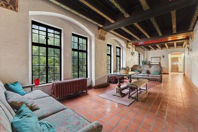 a living room with furniture and a large window
