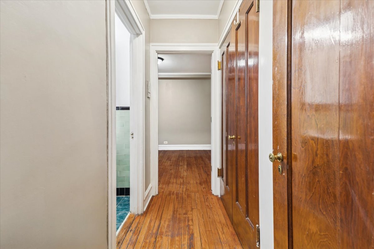 3017 East 78th Street, Unit 4B Chicago, IL 60649 - Photo 9 of 15 a view of a hallway with wooden floor