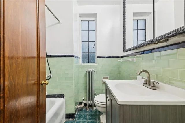 a bathroom with a sink and mirror