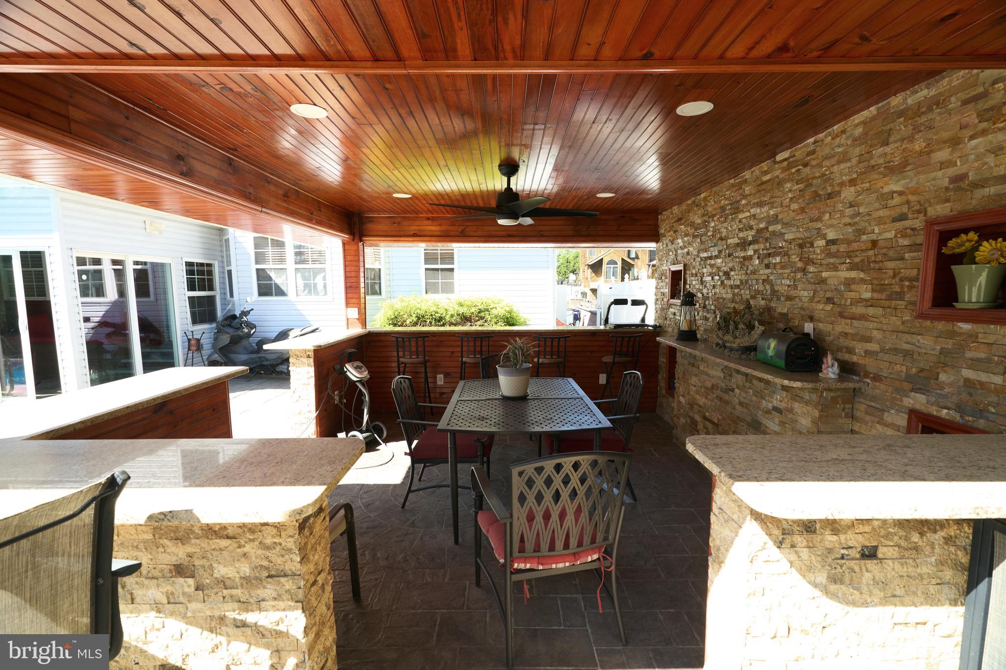 8905 Springview Road Philadelphia, PA 19115 - Photo 31 of 59 Poolside Bar & Dining space