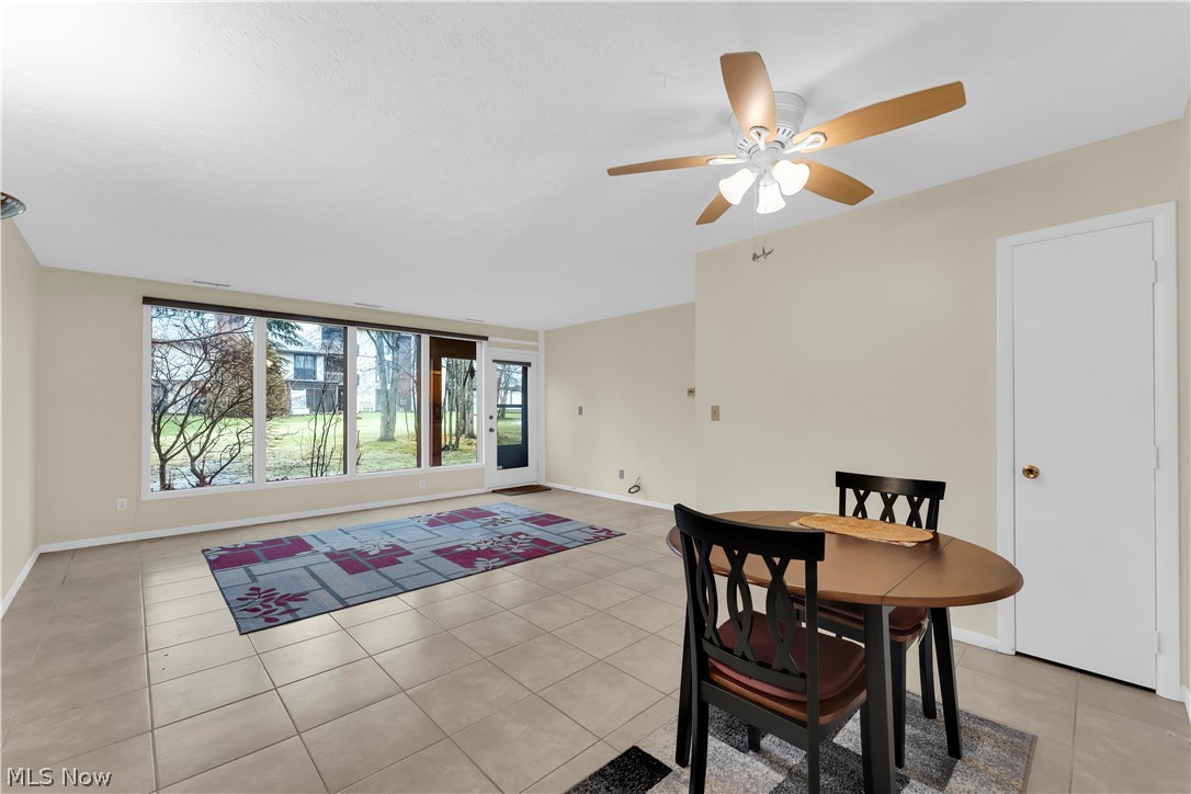 985 Canyon View Road, Unit 108D Northfield, OH 44067 - Photo 2 of 18 Dining room with a ceiling fan and light tile patterned floors