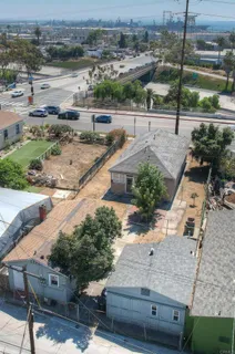 an aerial view of a house with a yard and lake view