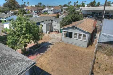 a aerial view of a house with a yard