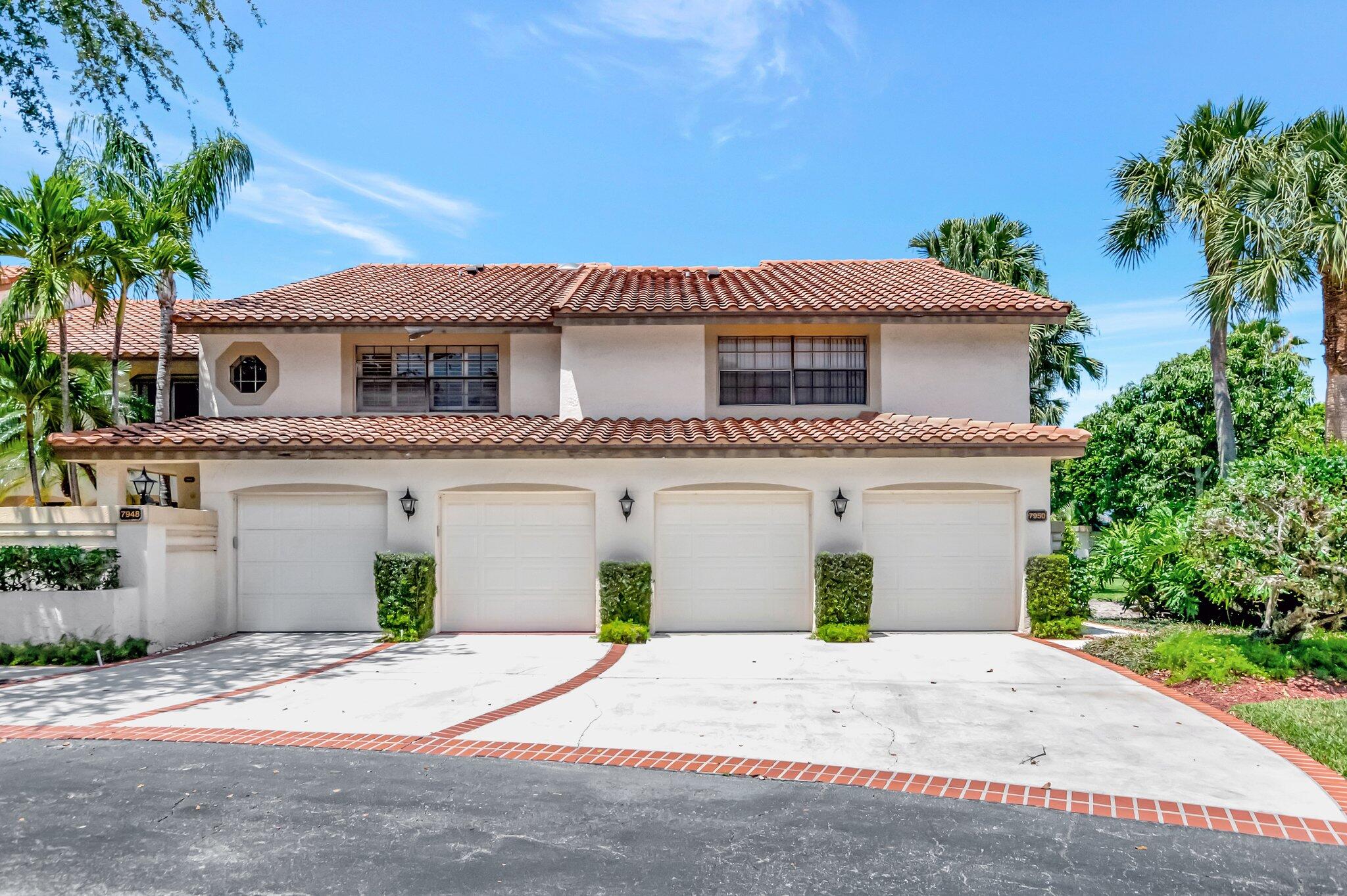 7950 La Mirada Drive Boca Raton, FL 33433 - Photo 1 of 42 a front view of a house with a garden