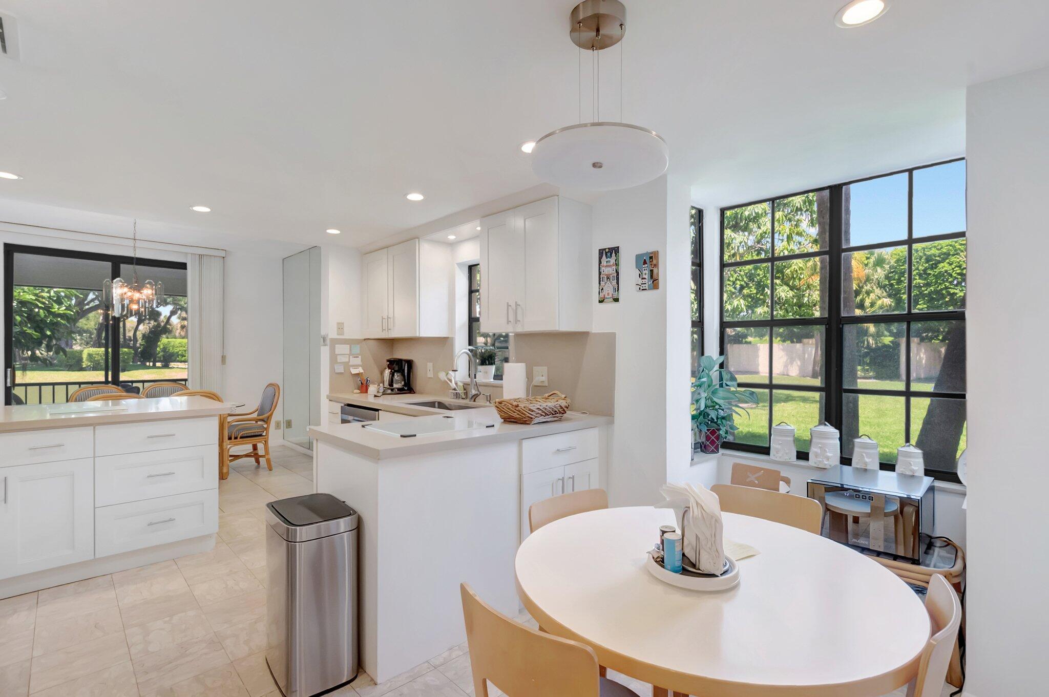 7950 La Mirada Drive Boca Raton, FL 33433 - Photo 15 of 42 a kitchen with a table and chairs
