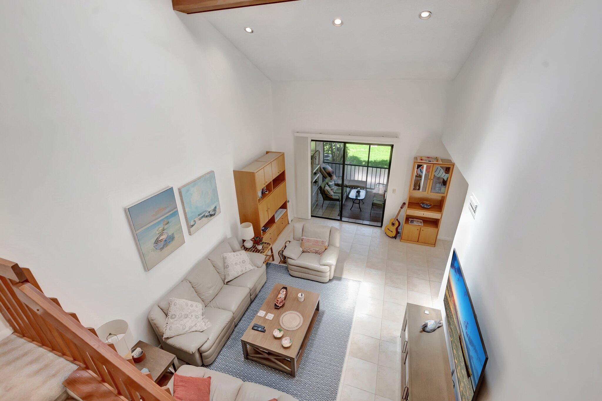 7950 La Mirada Drive Boca Raton, FL 33433 - Photo 16 of 42 a living room with furniture and a flat screen tv
