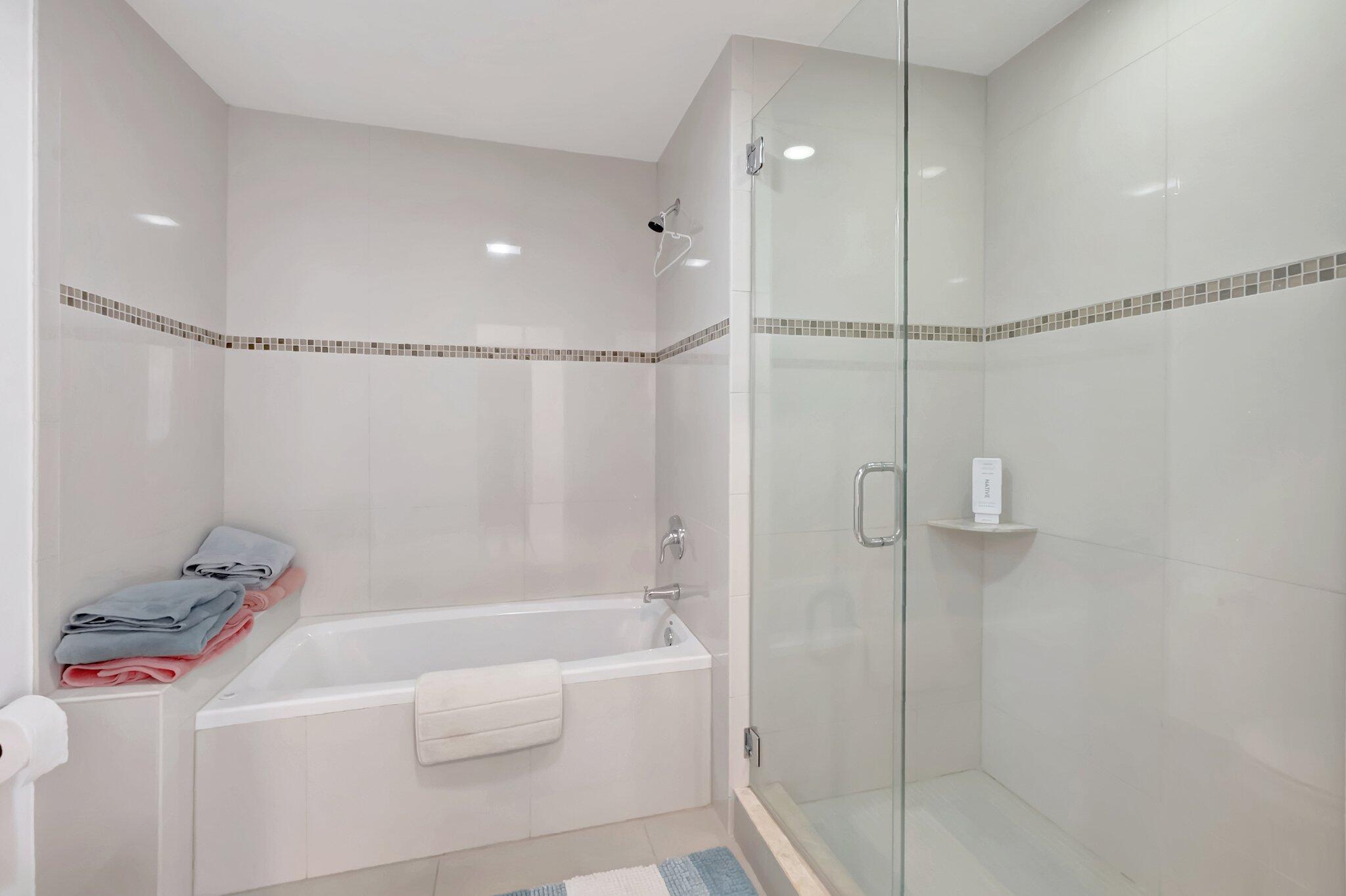 7950 La Mirada Drive Boca Raton, FL 33433 - Photo 22 of 42 a bathroom with a shower and a tub