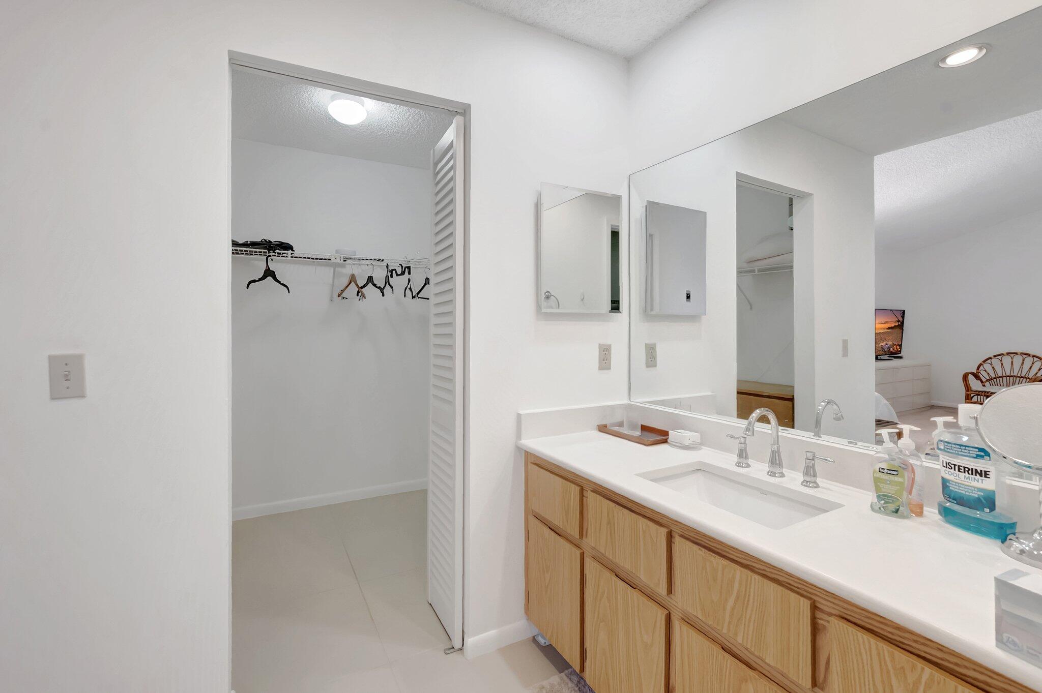 7950 La Mirada Drive Boca Raton, FL 33433 - Photo 23 of 42 a bathroom with a sink and a mirror