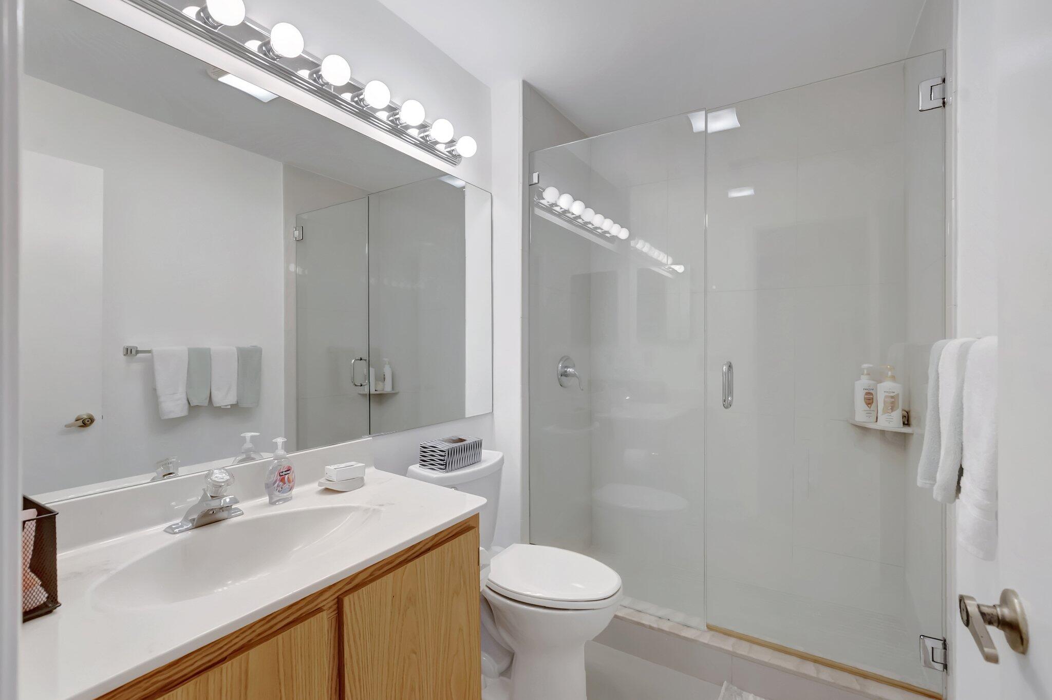 7950 La Mirada Drive Boca Raton, FL 33433 - Photo 26 of 42 a bathroom with a sink toilet and shower