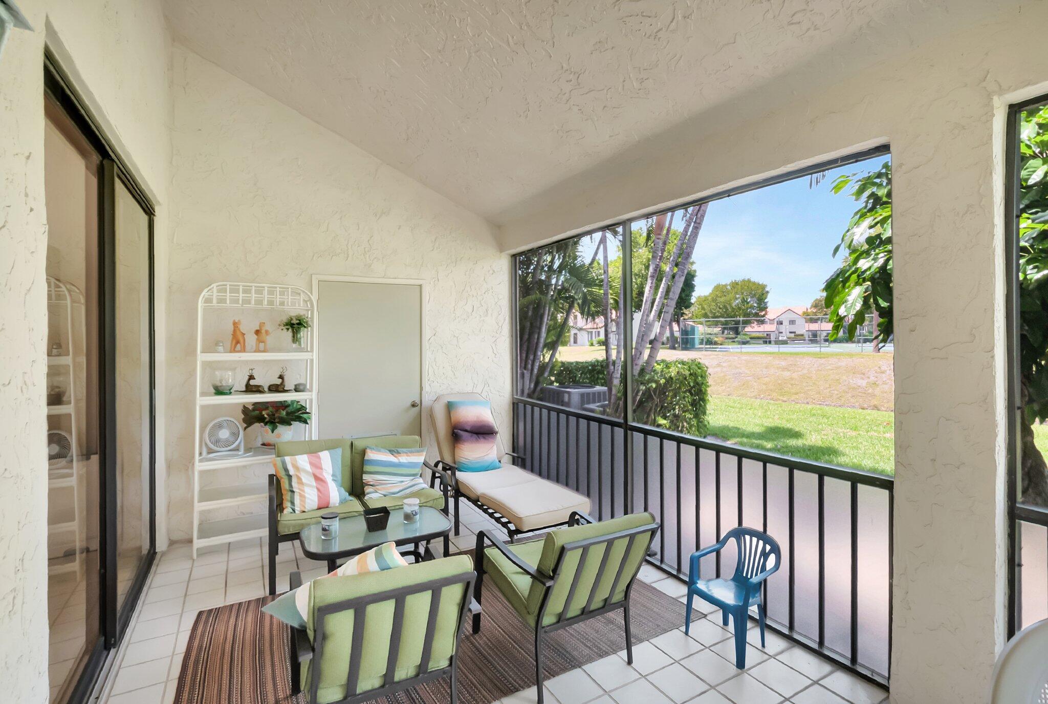 7950 La Mirada Drive Boca Raton, FL 33433 - Photo 32 of 42 a living room with furniture and a large window