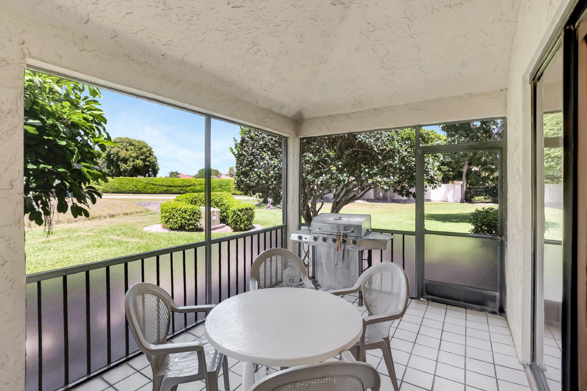 7950 La Mirada Drive Boca Raton, FL 33433 - Photo 34 of 42 a view of a chair and tables in the balcony