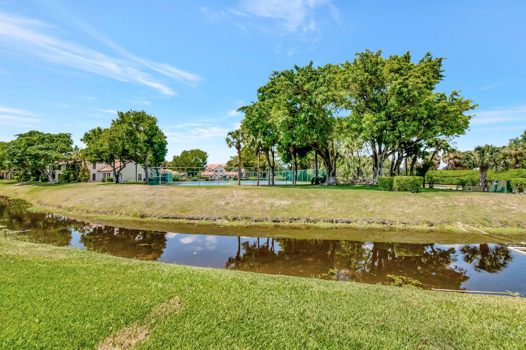 7950 La Mirada Drive Boca Raton, FL 33433 - Photo 39 of 42 a view of a lake with houses in the back