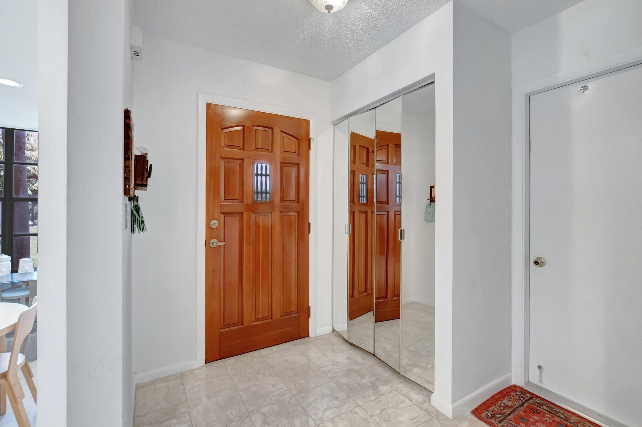 7950 La Mirada Drive Boca Raton, FL 33433 - Photo 4 of 42 a view of a hallway with wooden floor