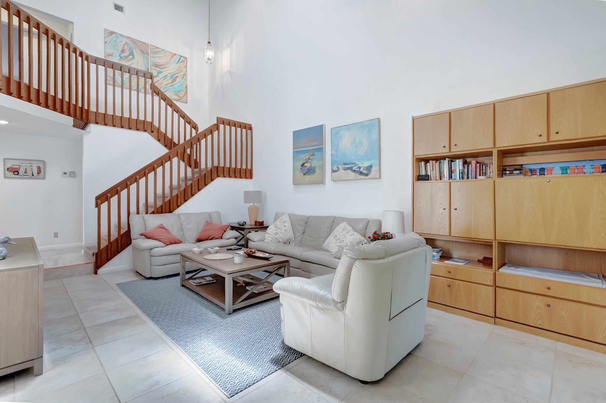 7950 La Mirada Drive Boca Raton, FL 33433 - Photo 7 of 42 a living room with furniture and a rug