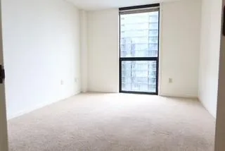 a view of an empty room with windows