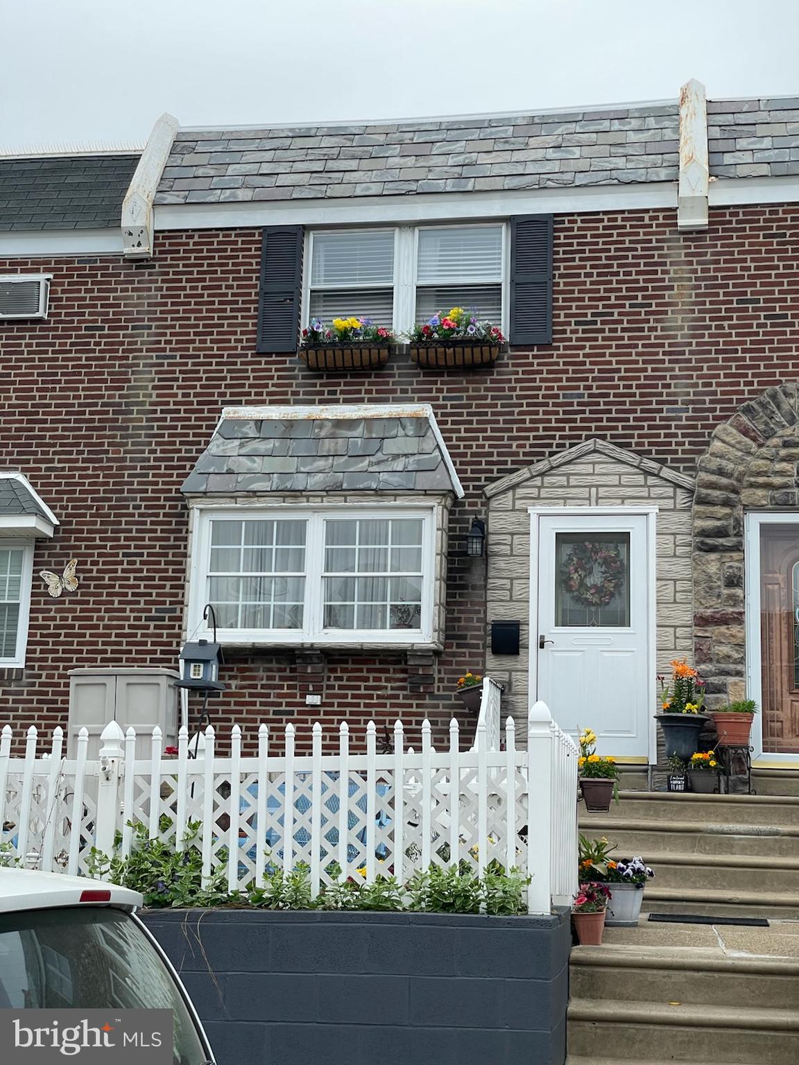 a front view of a house with garage