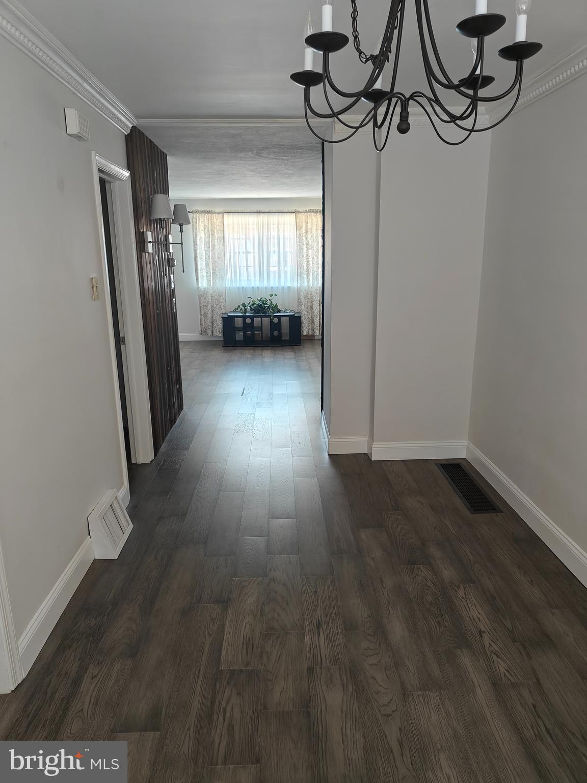 6448 Akron Street Philadelphia, PA 19149 - Photo 11 of 30 a view of a livingroom with wooden floor and stairs