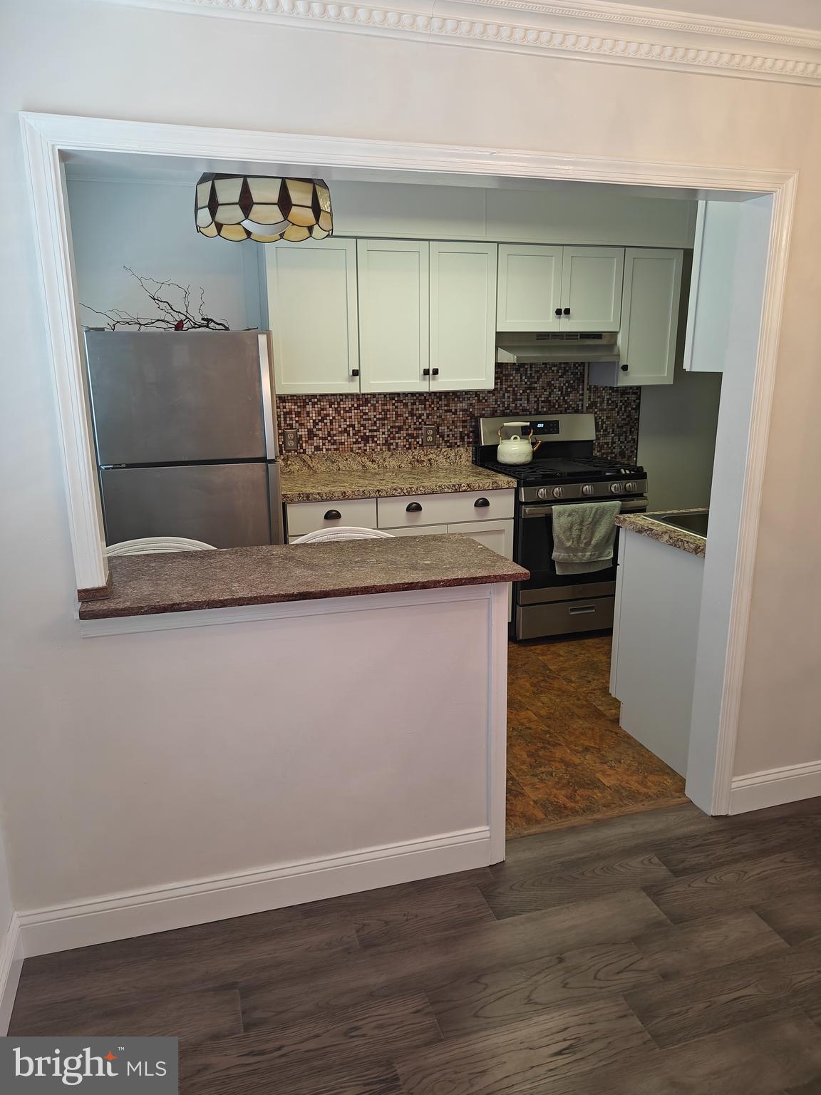 6448 Akron Street Philadelphia, PA 19149 - Photo 12 of 30 a kitchen with a sink and a stove top oven