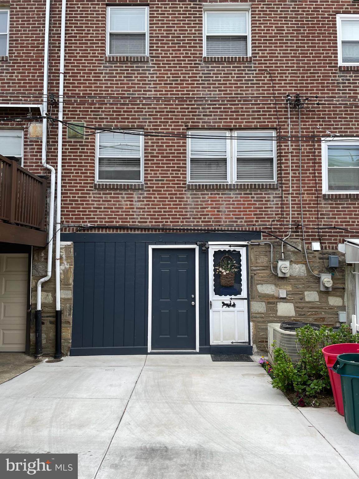 6448 Akron Street Philadelphia, PA 19149 - Photo 21 of 30 a front view of a building with a garden