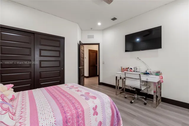 a view of entryway with wooden floor