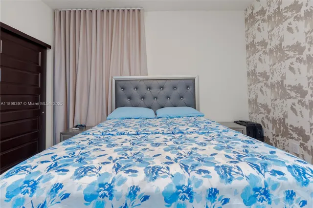 a bedroom with a bed and walk in closet