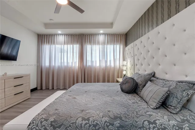 a view of an empty room and wooden floor