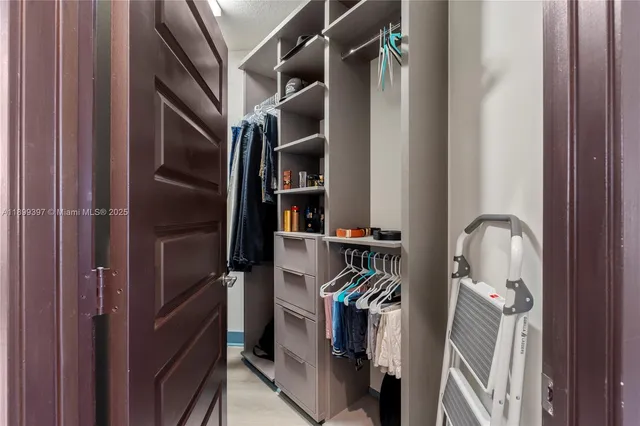 a bathroom with a shower and a sink