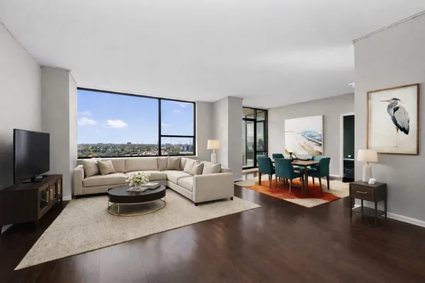 a living room with furniture and a flat screen tv