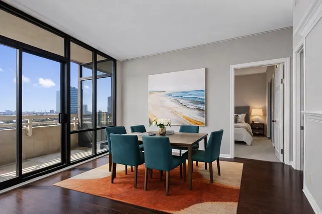a view of a dining room with furniture window and wooden floor