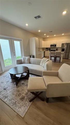 a living room with furniture and a rug