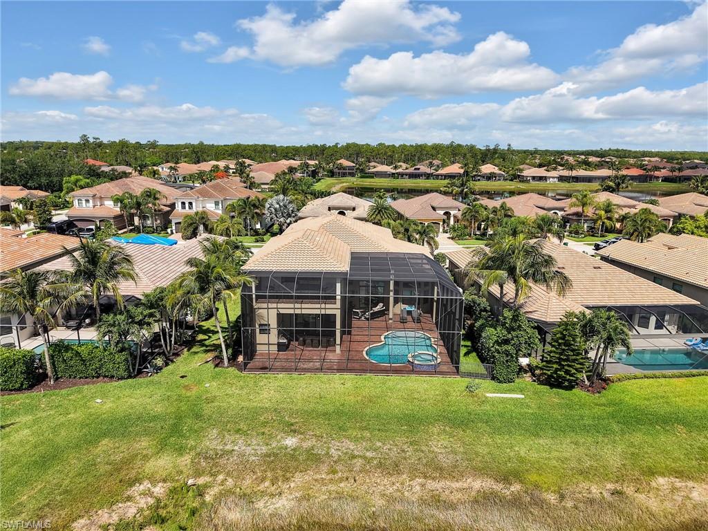 2756 Crystal Way Naples, FL 34119 - Photo 47 of 50 a view of a house with a garden