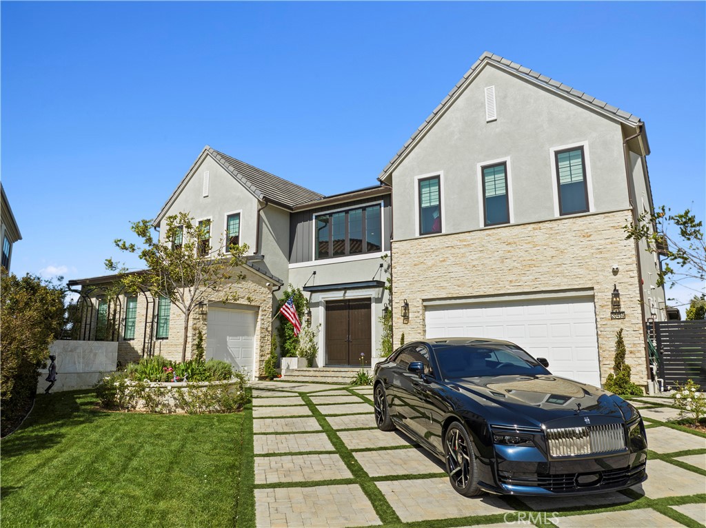 20450 Albion Way Porter Ranch, CA 91326 - Photo 4 of 75 a front view of a house with a garden