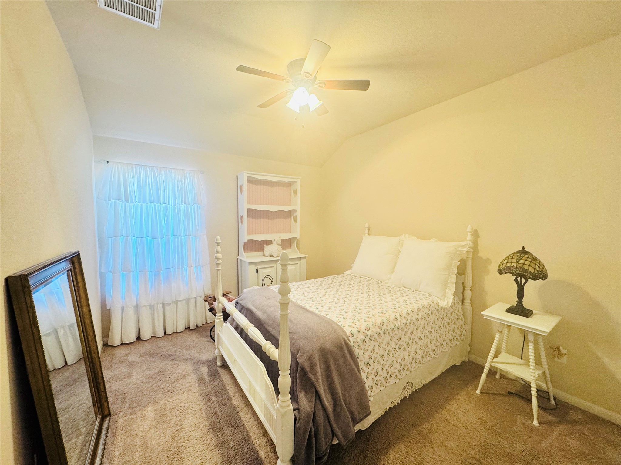 413 Gettysburg Loop Elgin, TX 78621 - Photo 22 of 32 Bedroom featuring carpet, a ceiling fan, and lofted ceiling