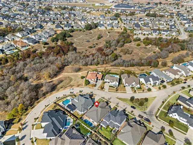 an aerial view of a building with an outdoor space