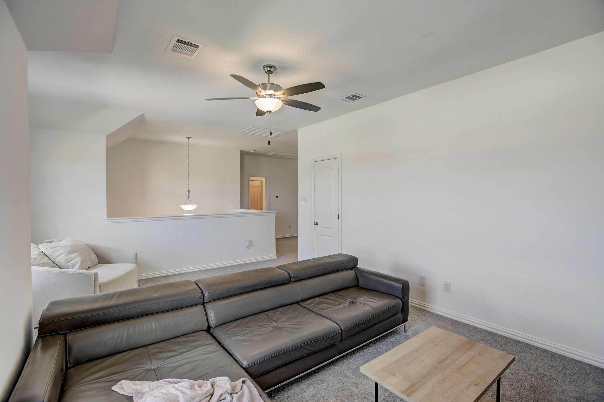 308 Monteforte Road Hutto, TX 78634 - Photo 28 of 32 a living room with furniture and a ceiling fan