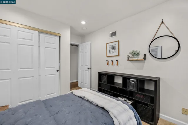 a bedroom with bed and a window