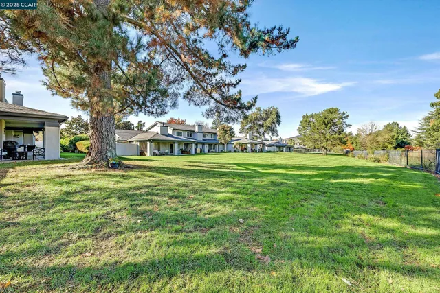 a view of a house with a big yard