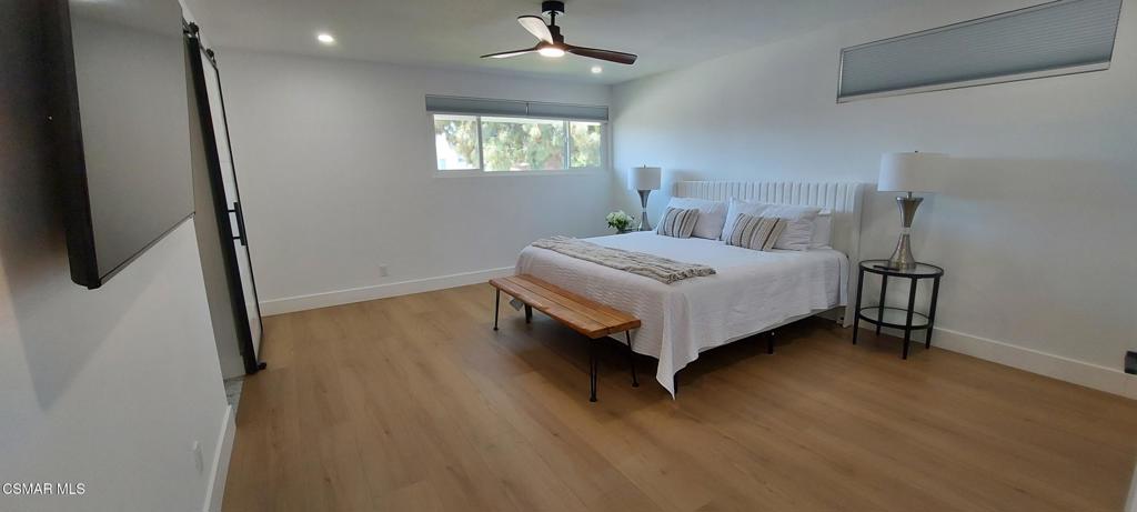 4071 Peoria Avenue Simi Valley, CA 93063 - Photo 12 of 19 a white bed sitting in a bedroom next to a window