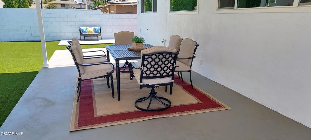 4071 Peoria Avenue Simi Valley, CA 93063 - Photo 18 of 19 a view of patio with a table and chairs