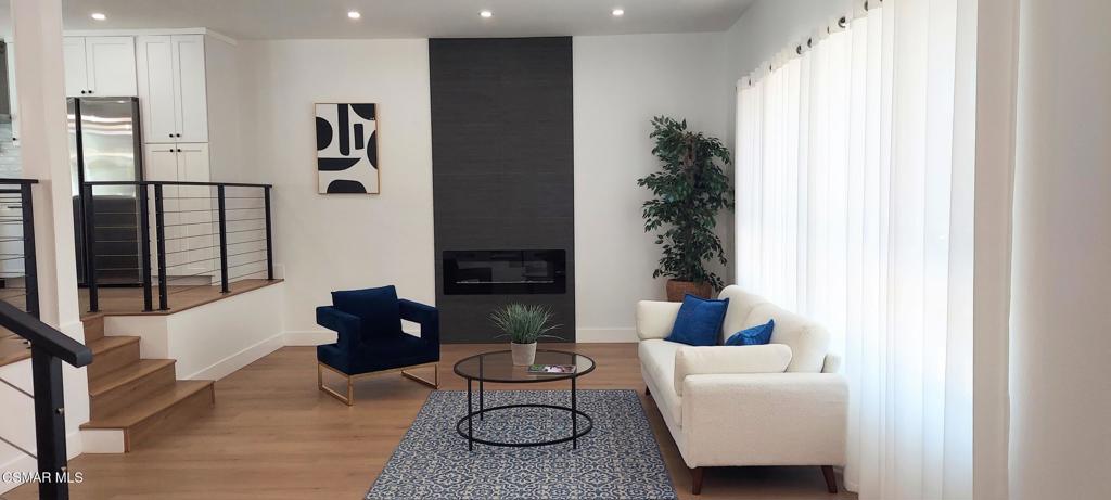4071 Peoria Avenue Simi Valley, CA 93063 - Photo 2 of 19 a living room with furniture potted plant and a window