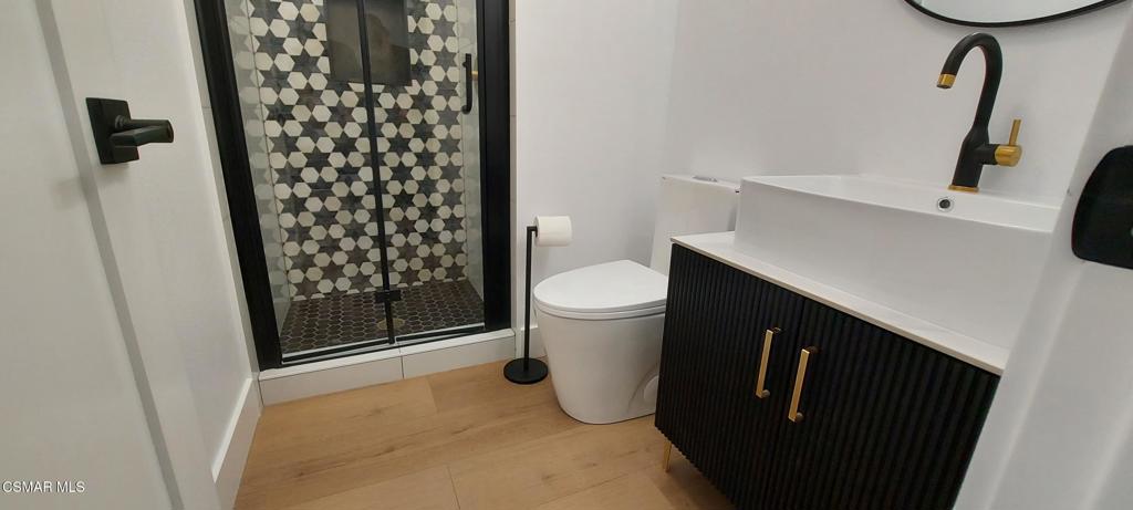 4071 Peoria Avenue Simi Valley, CA 93063 - Photo 8 of 19 a bathroom with a sink and a toilet