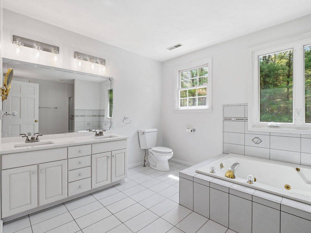10 Hawk Ridge Road Andover, MA 01810 - Photo 21 of 32 a spacious bathroom with a double vanity sink mirror and a bathtub