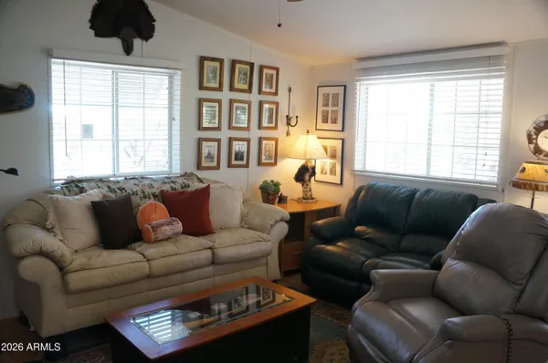 a living room with furniture and a window