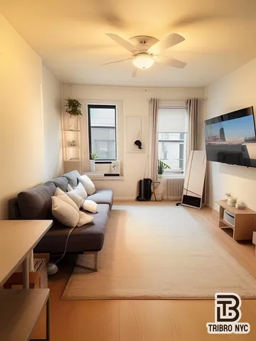 a bedroom with furniture and a window