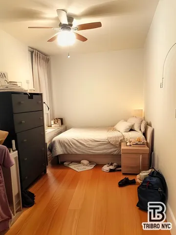 a bedroom with a bed and cabinets