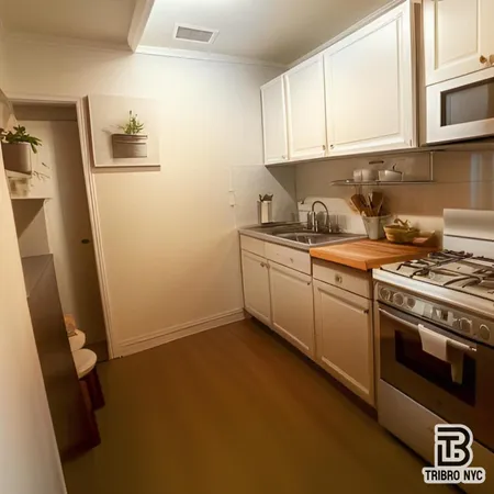 a kitchen with a sink stove and cabinets